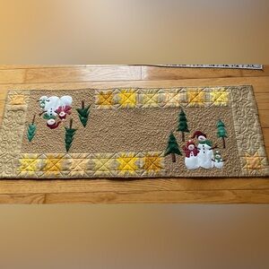 Quilted snowman table runner.